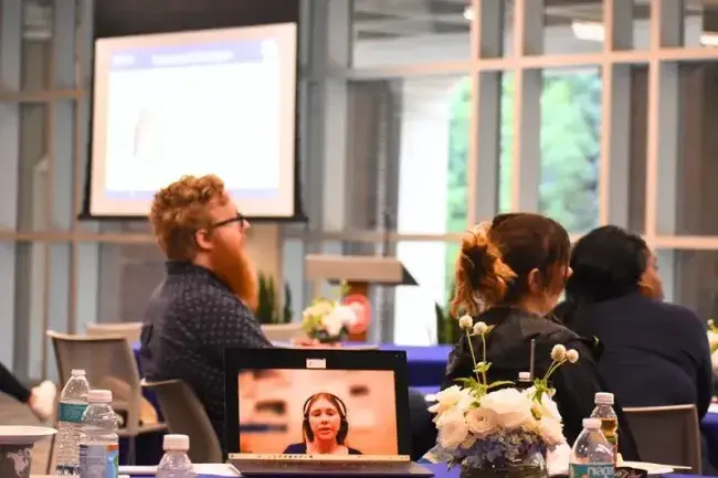 Hybrid meeting with participants attending both in-person and virtually